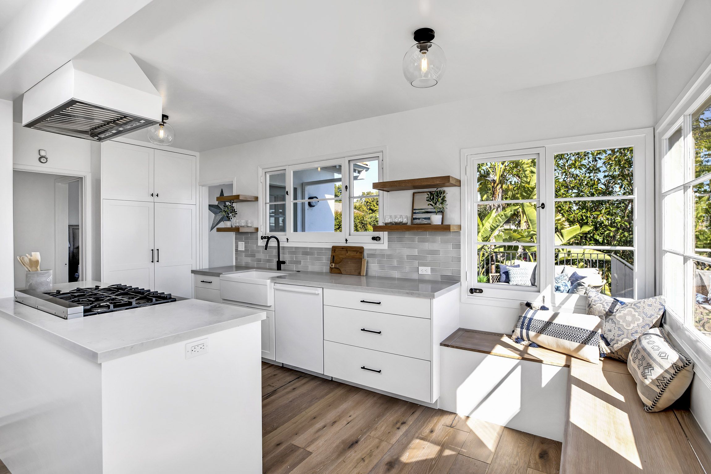 kitchen with sitting nook under windows